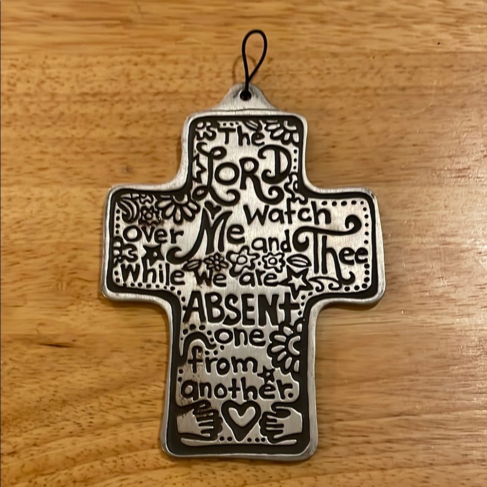 Small silver colored cross w/inspirational quote in black